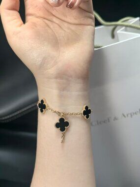 Van Cleef & Arpels Yellow Gold Bracelet with Black Alhambra Motifs